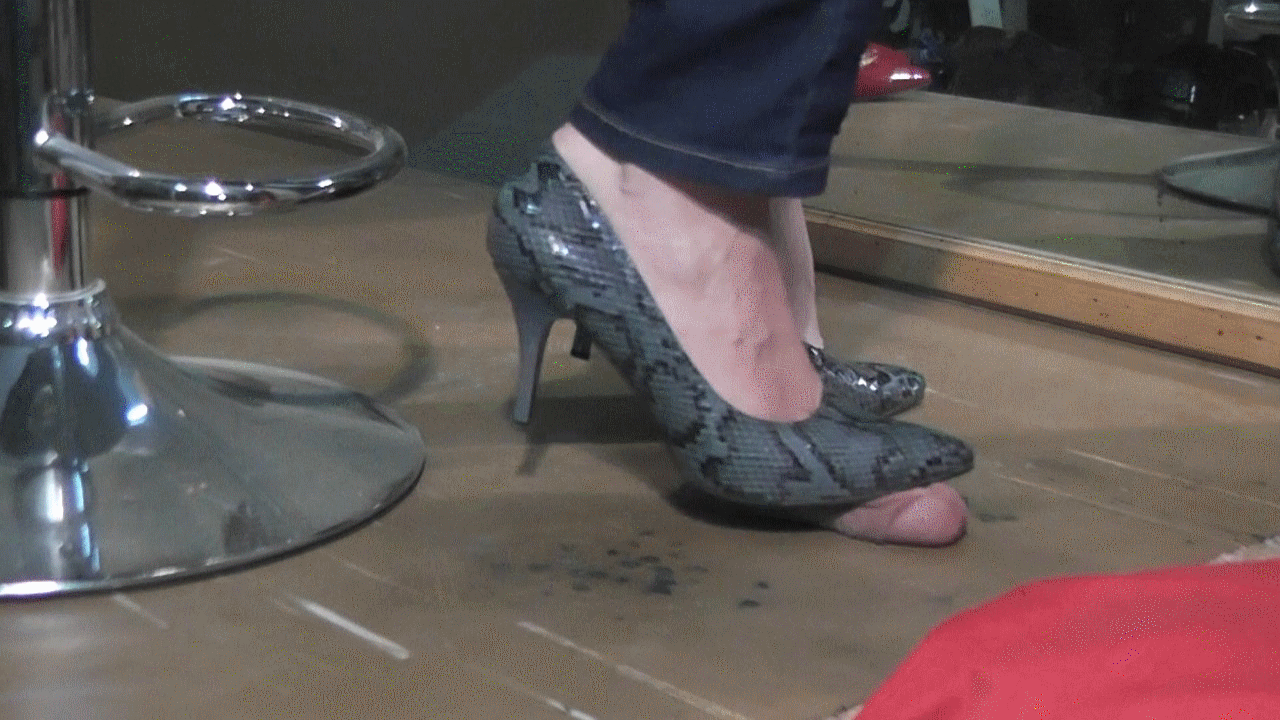 Cockcrush under plexiglass with barefeet and high heels.
